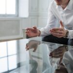 Man in White Dress Shirt Holding Persons Hand